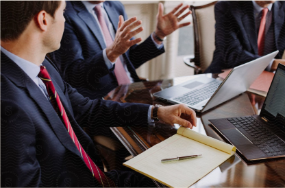 Lawyers in discussion around a boardroom table